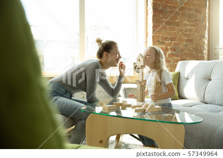 Teacher and little girl, or mom and daughter. Homeschooling concept 57349964