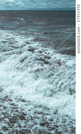 A breaking wave and stormy sea in a vertical panorama format A breaking wave and stormy sea in a vertical panorama format 57351459