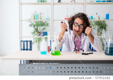 Funny male chemist working in the lab 57352282