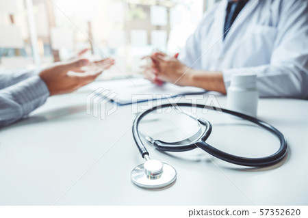 Doctors and patients consulting and diagnostic 57352620