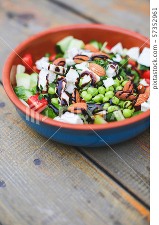 Fresh mixed green salad in a bowl close up Fresh mixed green salad in a bowl close up 57352961