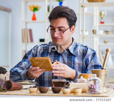 Professional tea expert trying new brews 57353267