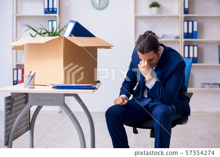 Young employee being made redundant Young employee being made redundant 57354274
