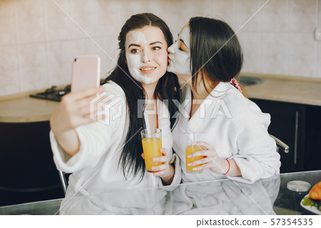 two girls with juice two girls with juice 57354535