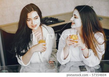 two girls with juice two girls with juice 57354604