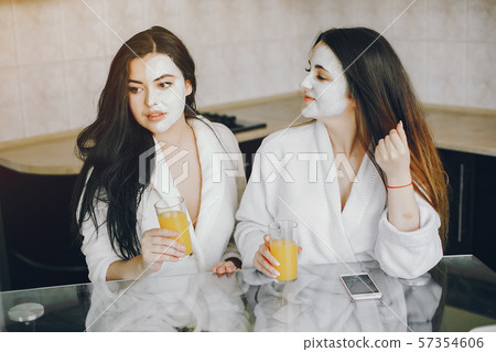 two girls with juice two girls with juice 57354606