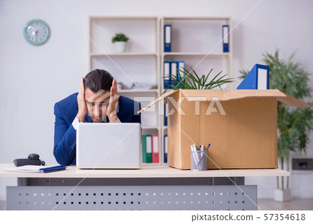 Young employee being made redundant Young employee being made redundant 57354618