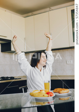 girl in a white dressing gown 57354847