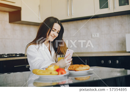 girl in a white dressing gown 57354895