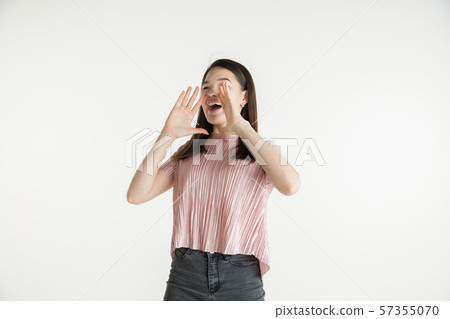 Beautiful girl's half-length portrait on white studio background Beautiful girl's half-length portrait on white studio background 57355070