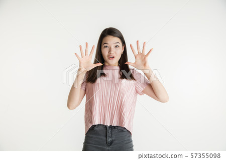 Beautiful girl's half-length portrait on white studio background Beautiful girl's half-length portrait on white studio background 57355098