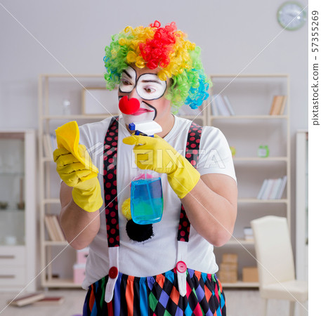 Funny clown doing cleaning at home Funny clown doing cleaning at home 57355269