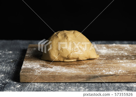 piece of dough on a table 57355926