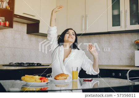 girl in a white dressing gown 57356011