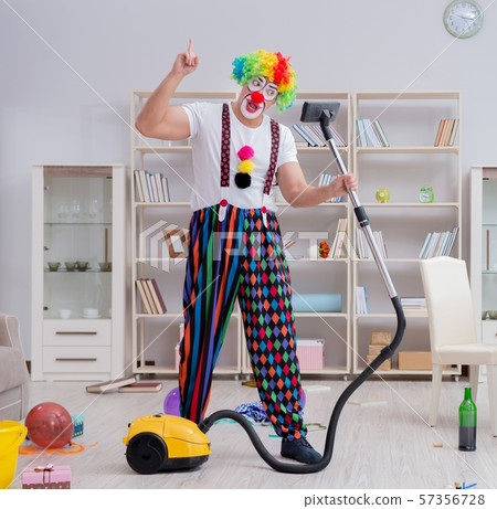 Funny clown doing cleaning at home 57356728
