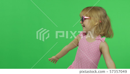 Happy, pretty child girl in pink swimsuit and sunglasses. Vacation. Chroma Key Happy, pretty child girl in pink swimsuit and sunglasses. Vacation. Chroma Key 57357049
