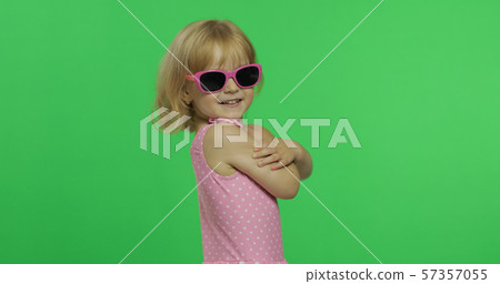 Child in pink swimsuit doing sports exercises, girl fitness training, dancing Child in pink swimsuit doing sports exercises, girl fitness training, dancing 57357055