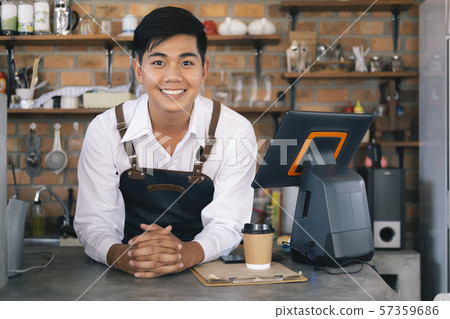 Small business happy owner of a coffee cafe. Small business happy owner of a coffee cafe. 57359686