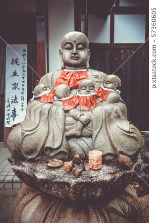 Jizo statue in Arashiyama temple, Kyoto, Japan 57360605