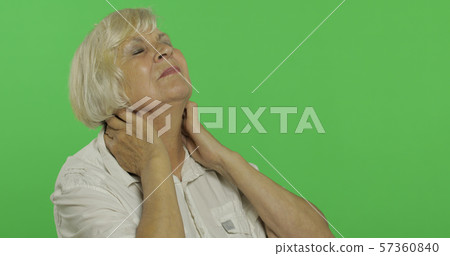 An elderly woman having pain in neck trouble. Old grandmother. Chroma key 57360840