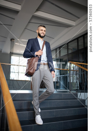 Office worker feeling excited having first working day in the office Office worker feeling excited having first working day in the office 57360933
