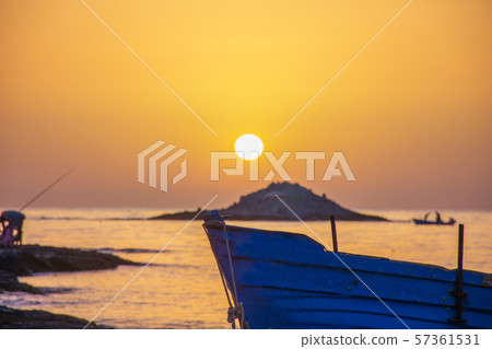 The sunset under the beautiful blue sky on beach The sunset under the beautiful blue sky on beach 57361531