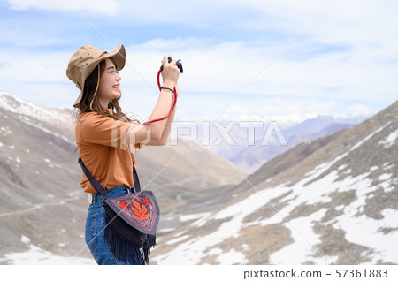 Young woman enjoy her camera in journey 57361883