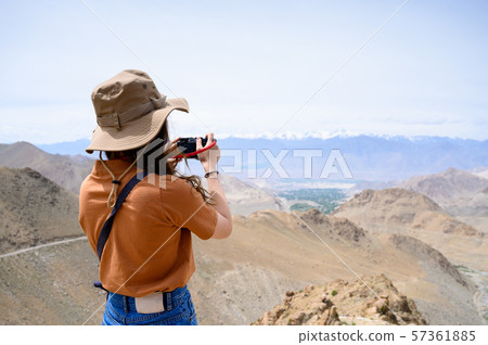 Young woman enjoy her camera in journey 57361885