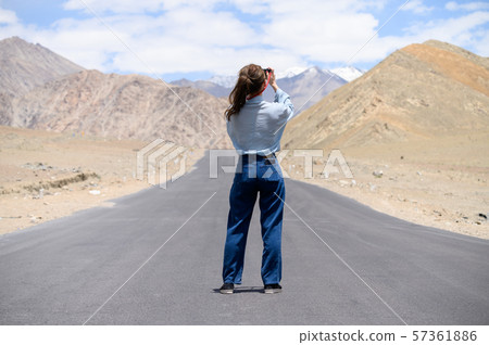Young woman enjoy her camera in journey 57361886