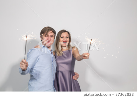 Party, celebration, event and holidays concept - man dressed in blue shirt and woman dressed in Party, celebration, event and holidays concept - man dressed in blue shirt and woman dressed in 57362828
