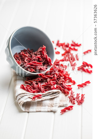 Uncooked colorful pasta with beetroot flavor Uncooked colorful pasta with beetroot flavor 57363626