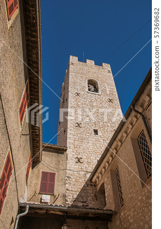 View of stone steeple tower next to church View of stone steeple tower next to church 57369682
