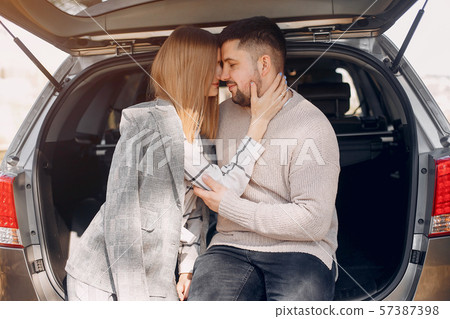 Beautiful couple spend time in a summer park 57387398