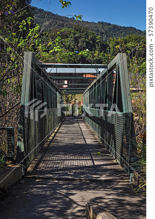 View of iron bridge over small river View of iron bridge over small river 57390470