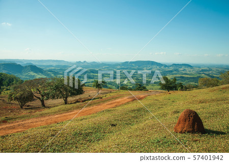 Meadows in a green valley with mound of tinder land Meadows in a green valley with mound of tinder land 57401942