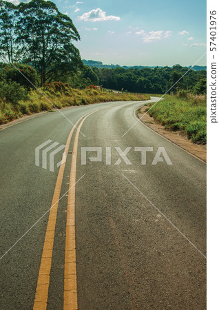 Countryside road on landscape with meadows and trees Countryside road on landscape with meadows and trees 57401976