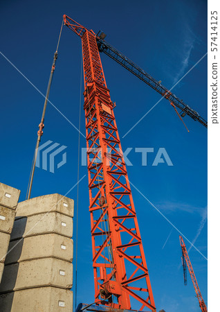 Close-up of crane in a construction area at sunset in Tielt Close-up of crane in a construction area at sunset in Tielt 57414125
