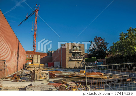 Construction area with crane at sunset in Tielt Construction area with crane at sunset in Tielt 57414129