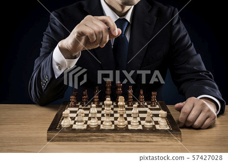 Businessman chess 57427028