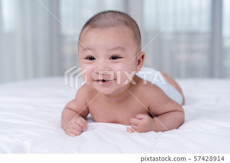 happy baby on a bed happy baby on a bed 57428914