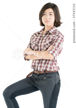 Young woman in a plaid shirt and arms crossed Young woman in a plaid shirt and arms crossed 57435133