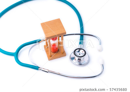 stethoscope and hourglass for doctor and medical nursing people check up healing of patients. 57435680