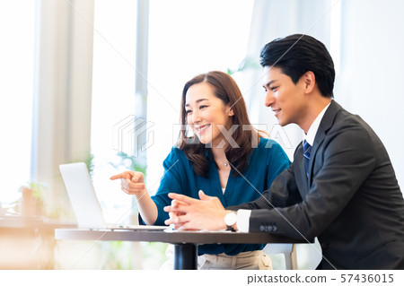 Business image Male employee Female employee Business meeting 57436015