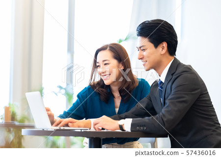 Business image Male employee Female employee Business meeting 57436016
