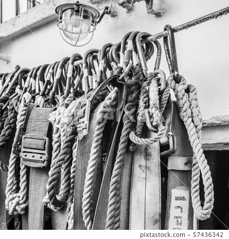 Safety belts on a sailboat, close-up. Black and 57436342