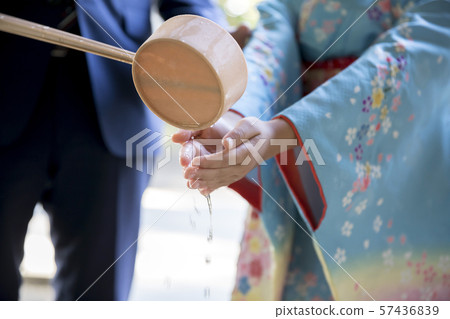 Seven hundred and fifty children washing their hands at a shrine 57436839