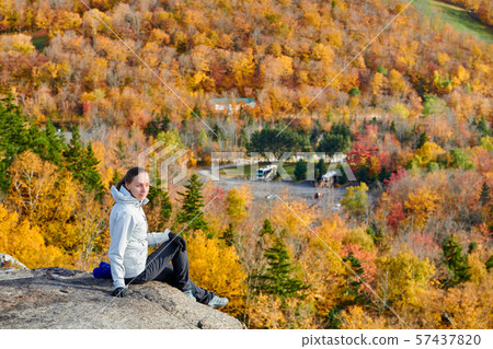 Woman hiking at Artist's Bluff in autumn Woman hiking at Artist's Bluff in autumn 57437820