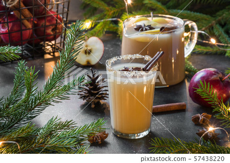 Apple cider cocktail with cardamom and star anise Apple cider cocktail with cardamom and star anise 57438220