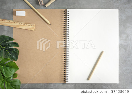 blank sketchbook and green leaves blank sketchbook and green leaves 57438649