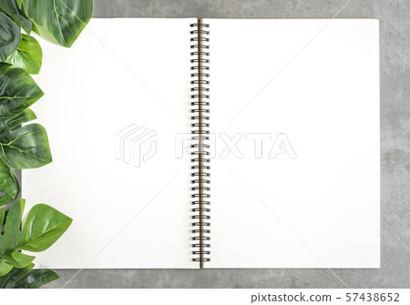 blank sketchbook and green leaves blank sketchbook and green leaves 57438652